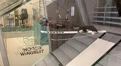 Skijumper inside indoor wingsuit tunnel